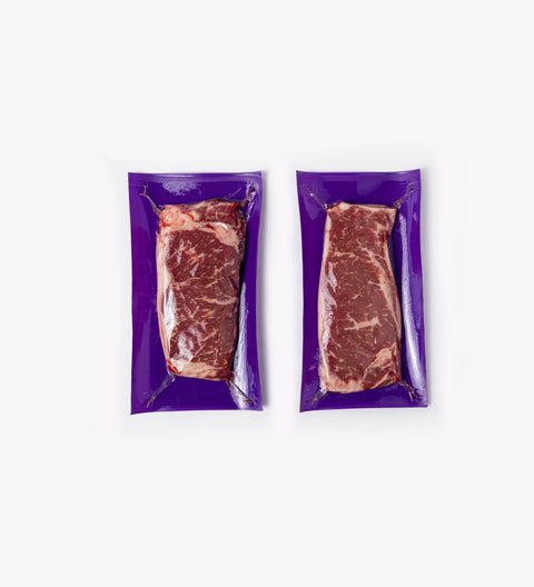 Bifteck de contrefilet de boeuf vieilli AAA (2 unités par sac - entre 560 et 720 g) Congelé